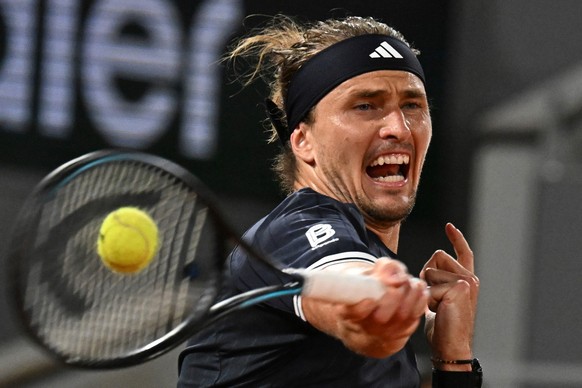 Alexander Zverev of Germany returns to Quentin Halys of France during their third round men's singles tennis match at the French Open tennis tournament in Paris, Friday, May 29, 2026. (AP Photo/E ...