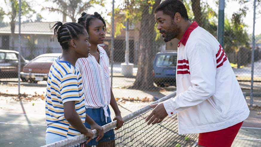 This image released by Warner Bros. Pictures shows Will Smith, right, with Demi Singleton, left, and Saniyya Sidney in a scene from &quot;King Richard.&quot; (Chiabella James/ Warner Bros. Pictures vi ...