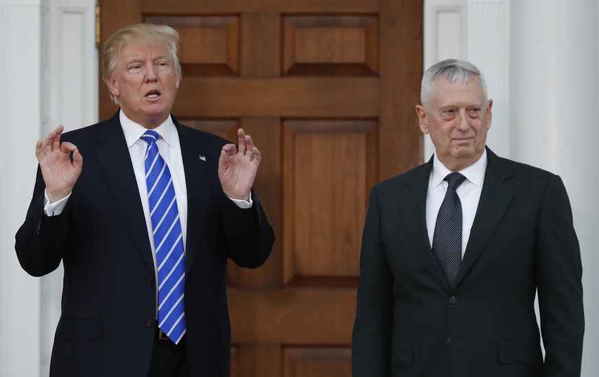 In this photo taken Nov. 19, 2016, Defense Secretary-designate James Mattis stands with President-elect Donald Trump in Bedminster, N.J. Senators signaled little opposition Tuesday, Jan. 10, 2017, to  ...