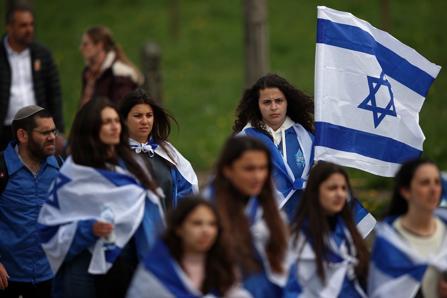 epa09914223 Participants take part in the &#039;March of the Living&#039; at the former Nazi concentration death camp Auschwitz in Oswiecim, Poland, 28 April 2022. The annual Holocaust-commemorating & ...