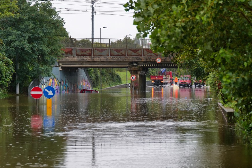 epa11613291 A car is trapped in the Celle underpass following the wave of bad weather that hit central Italy, in Rimini, Emilia-Romagna region, Italy, 19 September 2024. The low-pressure system Boris  ...