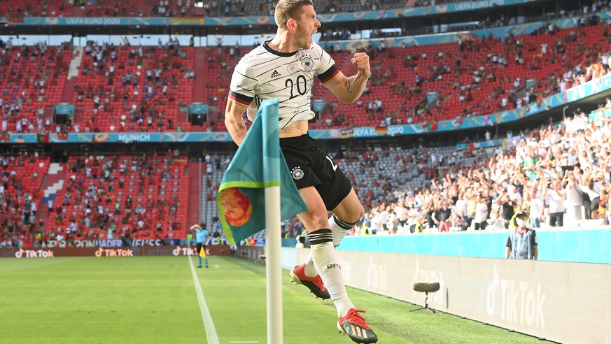 epa09285996 Robin Gosens of Germany celebrates after scoring a goal that was later disallowed during the UEFA EURO 2020 group F preliminary round soccer match between Portugal and Germany in Munich, G ...