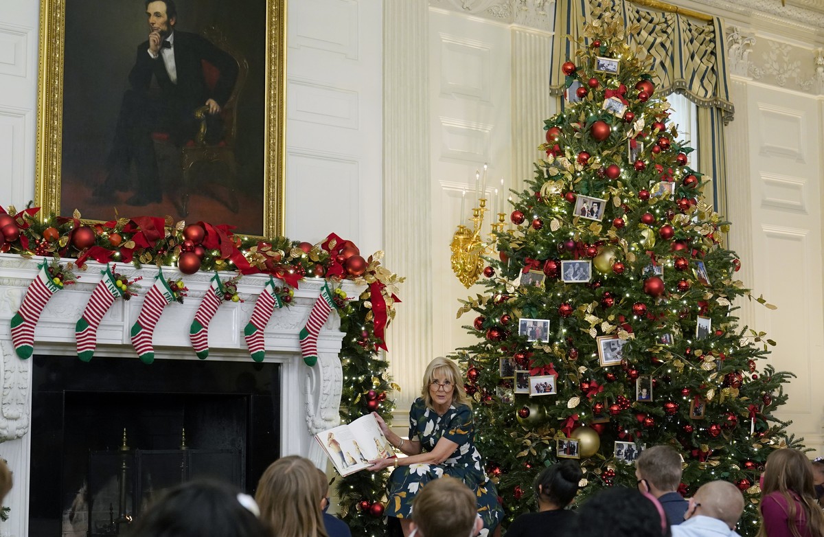 First lady Jill Biden reads a book co-written with grand daughter Natalie, "Don't Forget, God Bless Our Troops," to a group of students from Malcolm Elementary School in Waldorf, Md., i ...