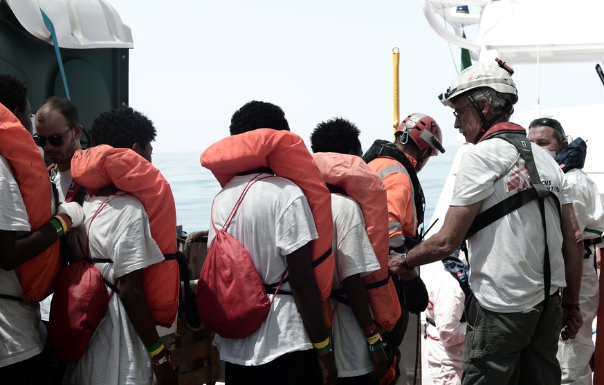 epa06802820 A handout photo made available by NGO &#039;SOS Mediterranee&#039; on 12 June 2018 shows some of the 629 migrants boarding rescue vessel &#039;Aqarius&#039; in the Mediterranean. The rescu ...