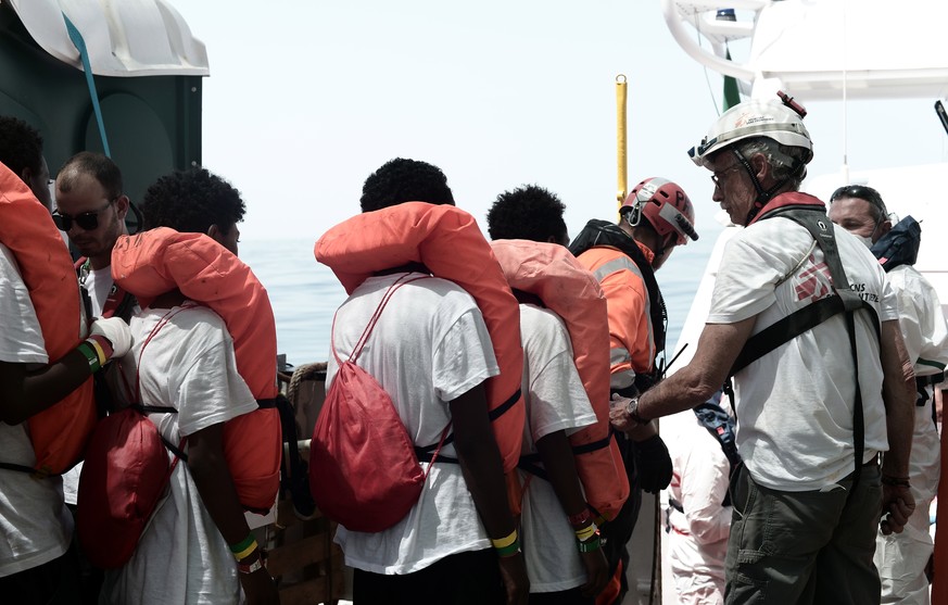 epa06802820 A handout photo made available by NGO 'SOS Mediterranee' on 12 June 2018 shows some of the 629 migrants boarding rescue vessel 'Aqarius' in the Mediterranean. The rescu ...