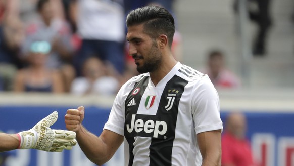 CORRECTS ID TO JUVENTUS MIDFIELDER EMRE CAN, NOT GOALKEEPER WOJCIECH SZCZESNY - Benfica goalkeeper Odisseas Vlachodimos, left, talks with Juventus midfielder Emre Can after Can scored his kick on Vlac ...