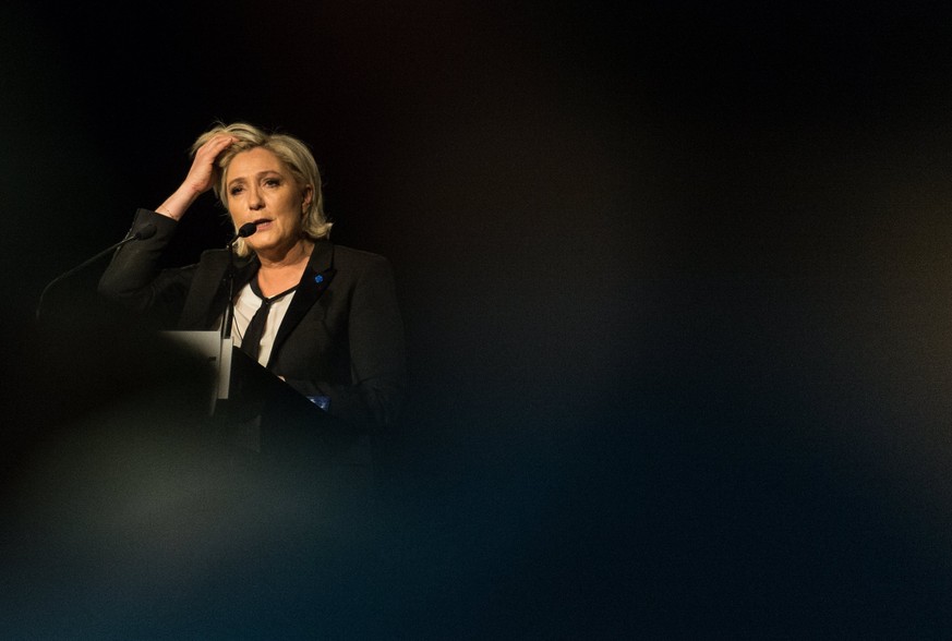 epa05890790 Marine Le Pen, French National Front (FN) political party leader and candidate for French 2017 presidential election, addresses supporters during a political rally in in Monswiller, France ...