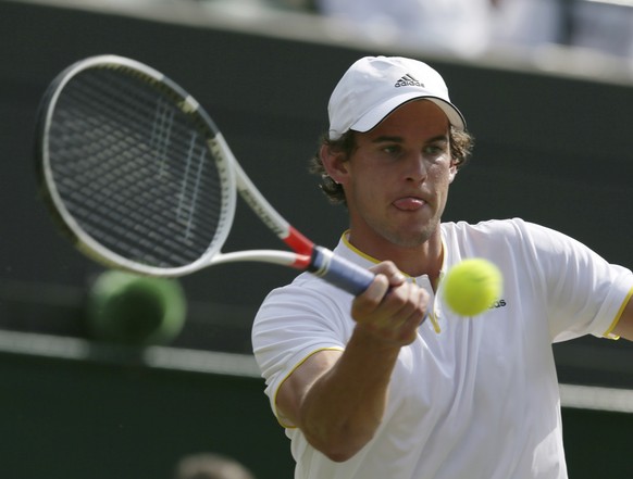 Austria&#039;s Dominic Thiem returns to Gilles Simon of France during their Men&#039;s Singles Match on day four at the Wimbledon Tennis Championships in London Thursday, July 6, 2017. (AP Photo/Tim I ...