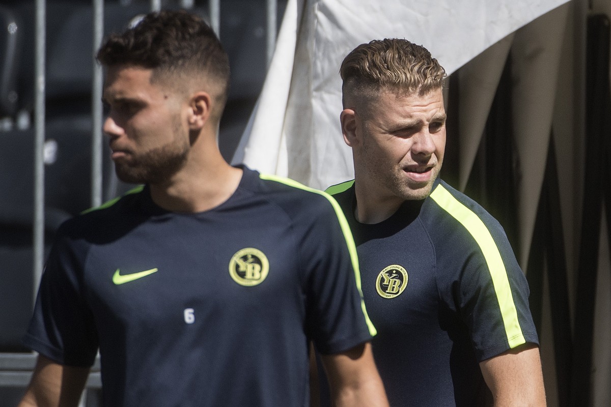 YB's player Leonardo Bertone, left, and Yoric Ravet, arrive during a training session one day prior to the UEFA Champions League playoff match between Switzerland's BSC Young Boys and Russia ...