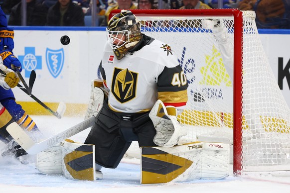 Vegas Golden Knights goaltender Akira Schmid (40) makes a pad save during the first period of an NHL hockey game against the Buffalo Sabres, Thursday, March 3, 2026, in Buffalo, N.Y. (AP Photo/Jeffrey ...