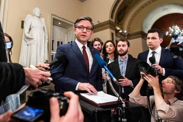 epa11290739 US Speaker of the House Mike Johnson (C) speaks to reporters after the House approved foreign aid packages to Ukraine, Israel, and Taiwan, as well as a bill requiring TikTok?s parent compa ...