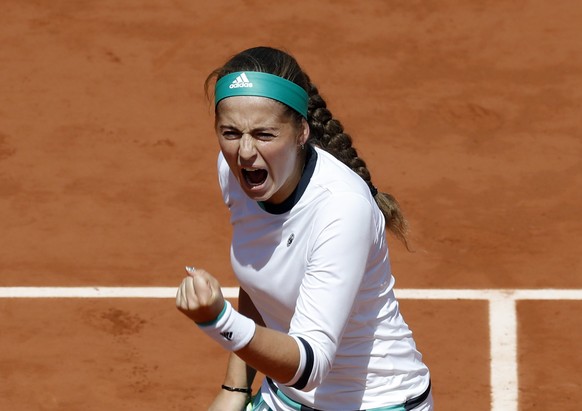 epa06013532 Jelena Ostapenko of Latvia reacts as she plays against Caroline Wozniacki of Denmark during their womenâs singles quarter final match during the French Open tennis tournament at Roland G ...