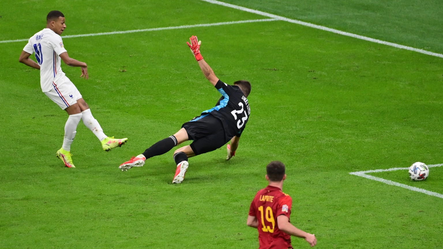 epa09517463 France?s Kylian Mbappe (2L) scores the 1-2 past Spain?s goalkeeper Unai Simon during the UEFA Nations League final between Spain and France in Milan, Italy, 10 October 2021. EPA/Marco Beto ...