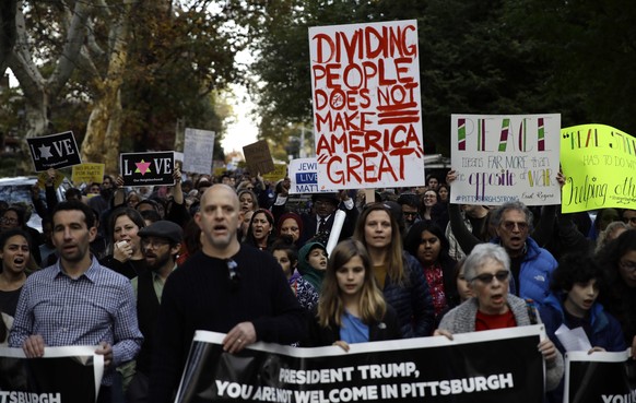 Protesters demonstrate near Pittsburgh&#039;s Tree of Life Synagogue where President Donald Trump and first lady Melania Trump were visiting a memorial in Pittsburgh, Tuesday, Oct. 30, 2018. The Trump ...