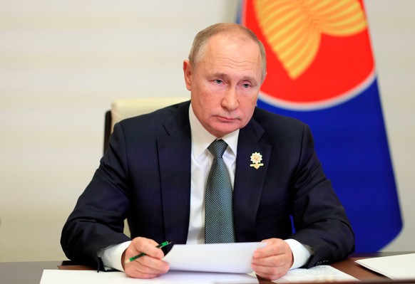 FILE - Russian President Vladimir Putin takes part in the Association of Southeast Asian Nations (ASEAN) summit via videoconference at the Novo-Ogaryovo residence outside Moscow, Russia, Oct. 28, 2021 ...