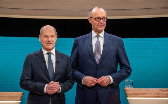 epa11884966 Incumbent German Chancellor and Social Democratic Party (SPD) leader Olaf Scholz (L) and Christian Democratic Union (CDU) leader Friedrich Merz (R) pose for a picture before their TV debat ...