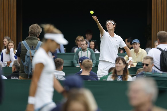 Marc-Andrea Huesler of Switzerland in action during his first round match against Hugo Grenier of France, at the All England Lawn Tennis Championships in Wimbledon, London, Tuesday, June 28, 2022. (KE ...