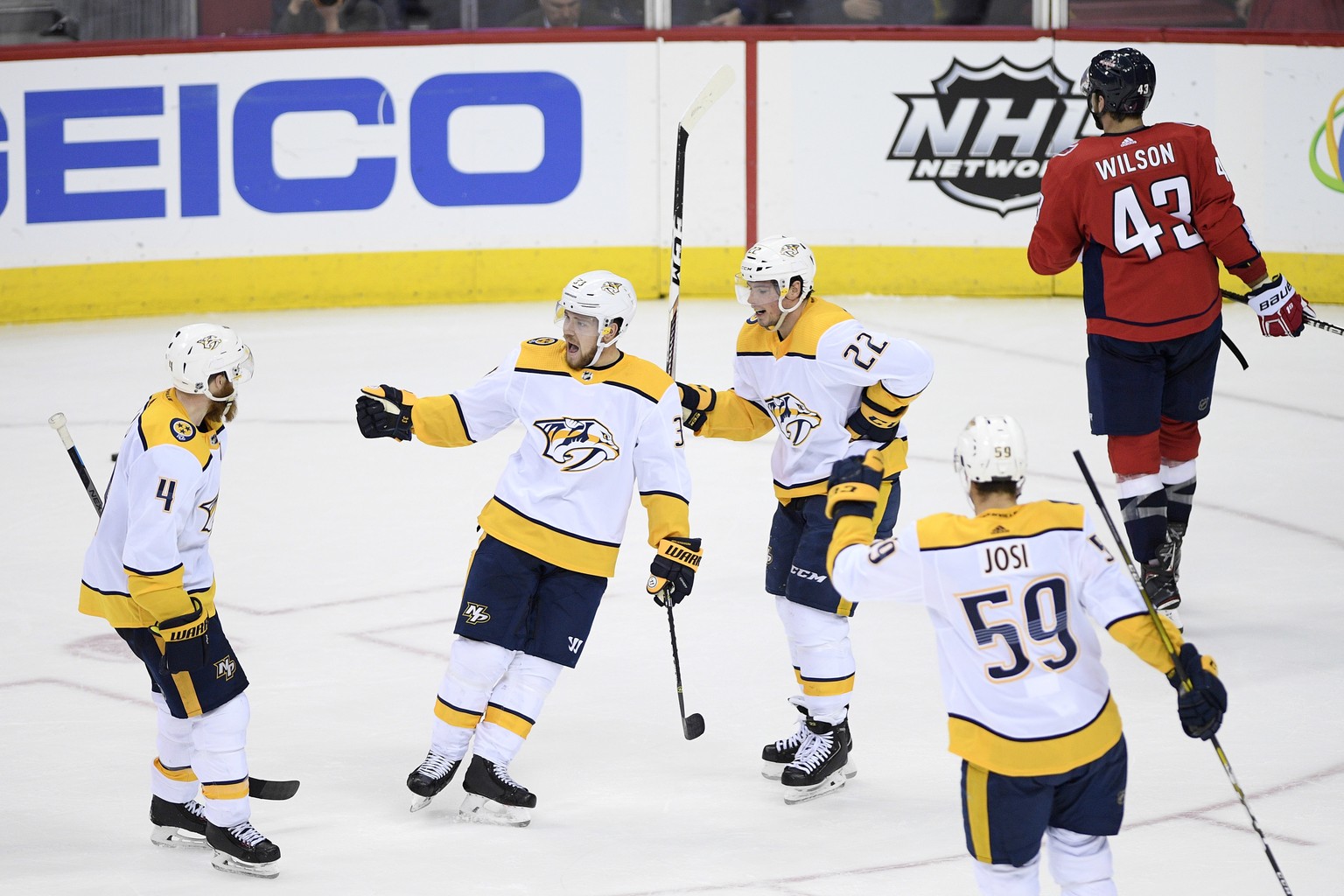 Nashville Predators right wing Viktor Arvidsson (33), of Sweden, celebrates his goal with defenseman Ryan Ellis (4), left wing Kevin Fiala (22) and defenseman Roman Josi (59), of Switzerland, during t ...