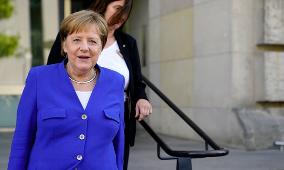 epa06858131 German Chancellor Angela Merkel of the Christian Democratic Union (CDU), leaves the Reichstag building, the seat of German Bundestag, in Berlin, Germany, 02 July 2018. According to media r ...