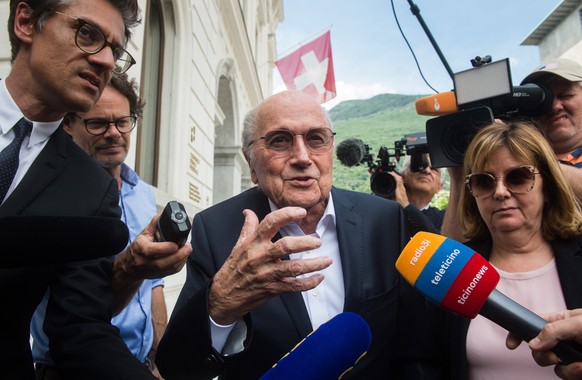 Former FIFA president Sepp Blatter is surrounded by the media as he leaves the Swiss Federal Criminal Court in Bellinzona, Switzerland, Wednesday, June 8, 2022. Blatter and former UEFA president Miche ...