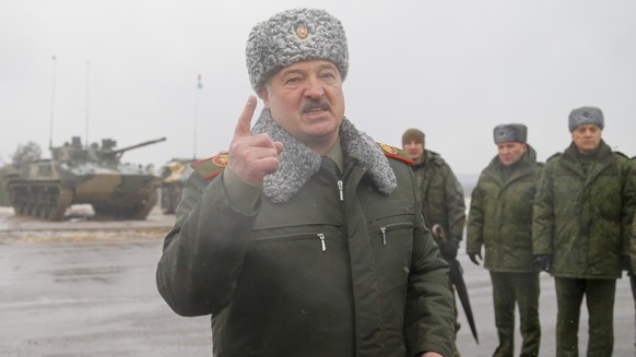 FILE - Belarusian President Alexander Lukashenko gestures while speaking to journalists at the Osipovichi training ground during the Union Courage-2022 Russia-Belarus military drills near Osipovichi , ...