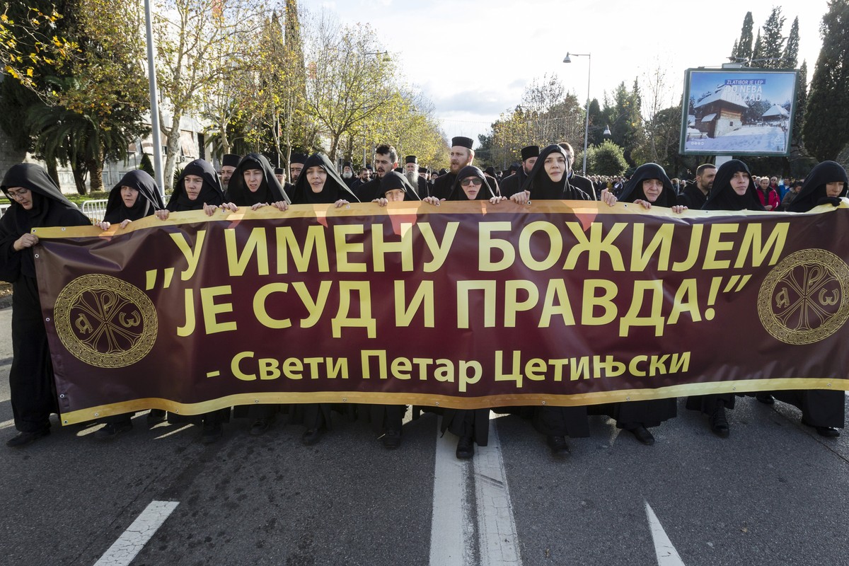 Serbian Orthodox Church clergy in Montenegro march and hold a banner reading: ''Judgment and Justice are in God's name'' as they protest the planned adoption of a religious la ...