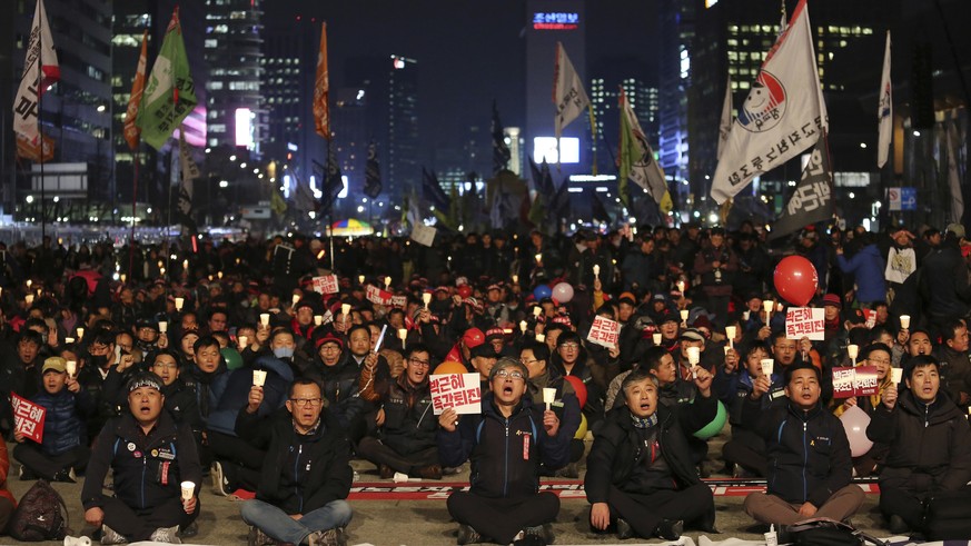 Protesters stage a rally calling for South Korean President Park Geun-hye to step down in Seoul, South Korea, Wednesday, Nov. 30, 2016. South Korean President Park Geun-hye&#039;s conditional resignat ...