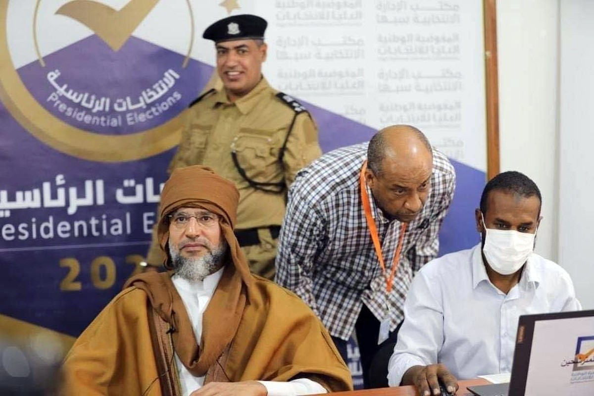 epa09581837 A handout photo made available by the Libyan High National Commission Facebook Page on 14 November 2021 shows Saif al-Islam Gaddafi (L), son of the former Libyan leader Muammar Gaddafi reg ...