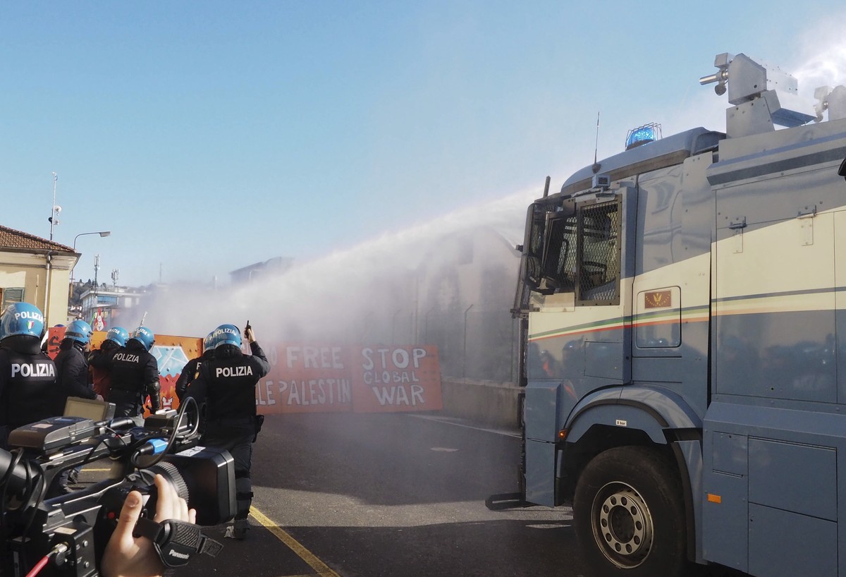Anti-Israel protesters clash with police in the northern Italian city of Vicenza on Saturday, Jan. 20, 2024, after they attempted to enter the trade fair grounds to protest the presence of an Israeli  ...