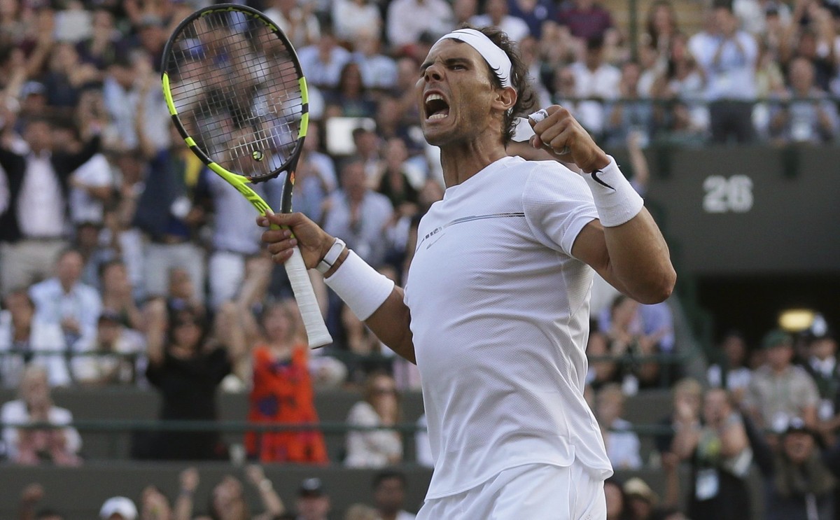 Spain's Rafael Nadal reacts after winning a point against Luxembourg's Gilles Muller during their Men's Singles Match on day seven at the Wimbledon Tennis Championships in London Monday ...