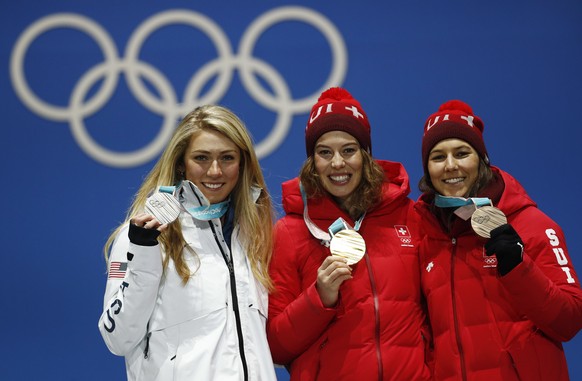 Medalists in the women&#039;s combined, from left, United States&#039; Mikaela Shiffrin, silver, Switzerland&#039;s Michelle Gisin, gold, and Switzerland&#039;s Wendy Holdener, bronze, pose during the ...