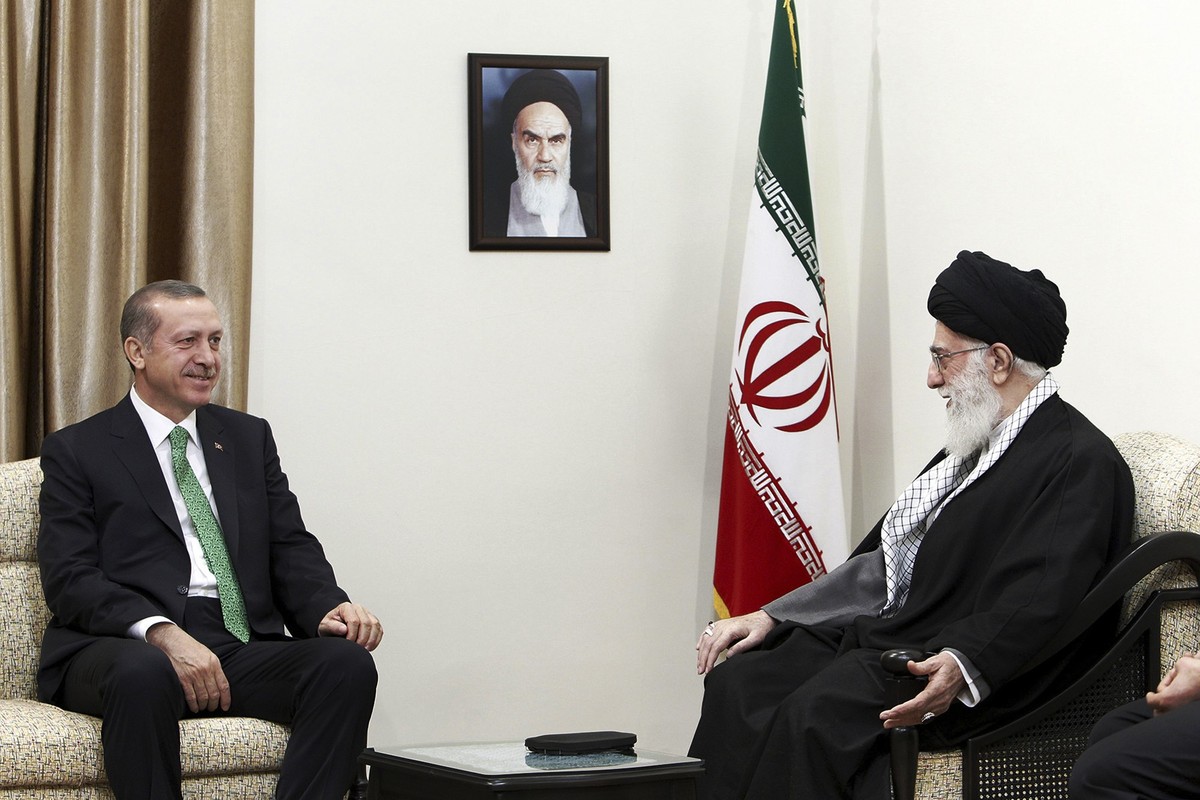 In this picture released by an official website of the office of the Iranian supreme leader, Supreme Leader Ayatollah Ali Khamenei, right, talks with Turkish Prime Minister Recep Tayyip Erdogan, durin ...