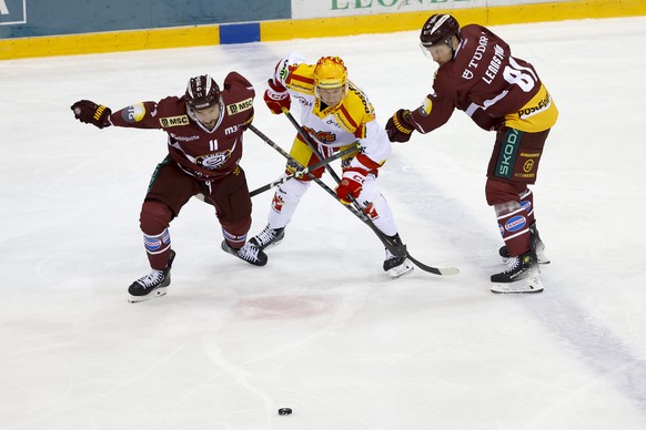 Biel&#039;s forward Toni Rajala, centre, vies for the puck with Geneve-Servette&#039;s forward Vincent Praplan # 11 and Geneve-Servette&#039;s defender Theodor Lennstrom #81, during a National League  ...