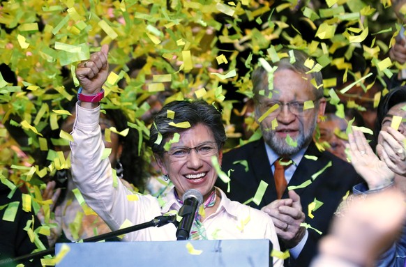 epa07955484 The mayor-elect of Bogota from the Alianza Verde movement, Claudia Lopez celebrates her victory in the regional elections, in Bogota, Colombia, 27 October 2019. The former senator and form ...