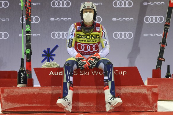 Norway&#039;s Henrik Kristoffersen sits on the podium after winning an alpine ski, men&#039;s World Cup slalom in Madonna di Campiglio, Italy, Tuesday, Dec. 22, 2020. (AP Photo/Alessandro Trovati)