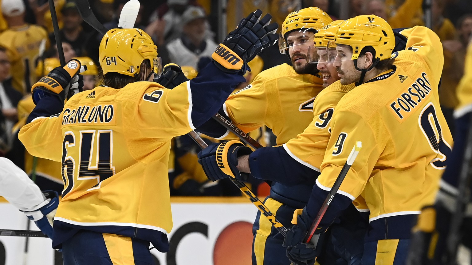 Nashville Predators defenseman Roman Josi, second from left, celebrates with teammates after scoring a goal against the Colorado Avalanche during the second period in Game 3 of an NHL hockey Stanley C ...