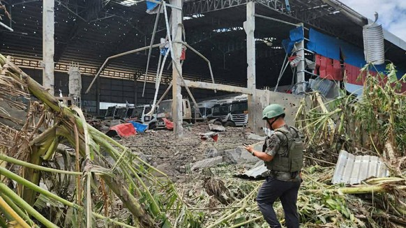 In this photo released by Agence Kampuchea Press (AKP), a distraction building is seen after a Thai bombing in Poipet town, Banteay Meanchey Province, Cambodia, Thursday, Dec. 18, 2025. (AKP via AP)
C ...