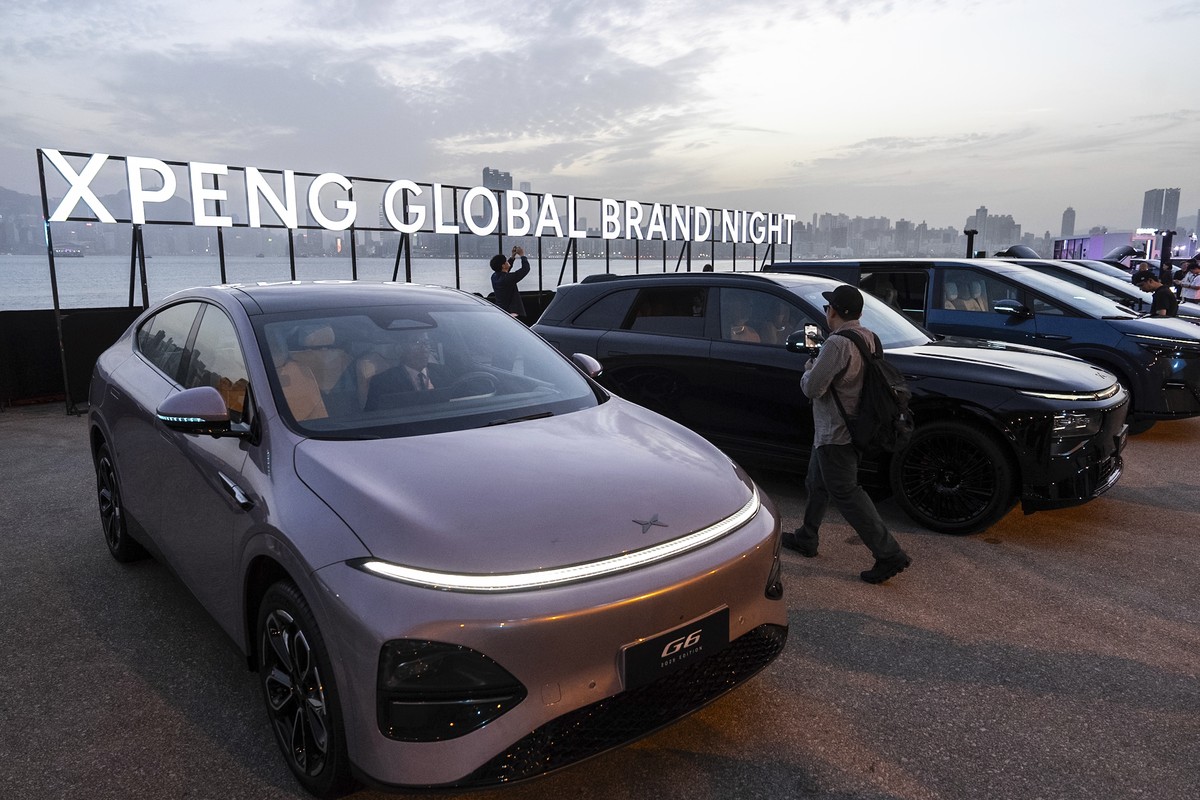 An XPeng G6 electric vehicle and other models are displayed at the company's showcase event in Hong Kong on Tuesday, April 15, 2025. (AP Photo/Chan Long Hei)
Hong Kong XPeng Auto Show
