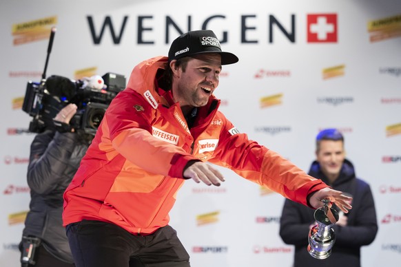 Fifth placed Beat Feuz of Switzerland celebrates at the award ceremony of the men's downhill race at the Alpine Skiing FIS Ski World Cup in Wengen, Switzerland, Saturday, January 14, 2023. (KEYST ...