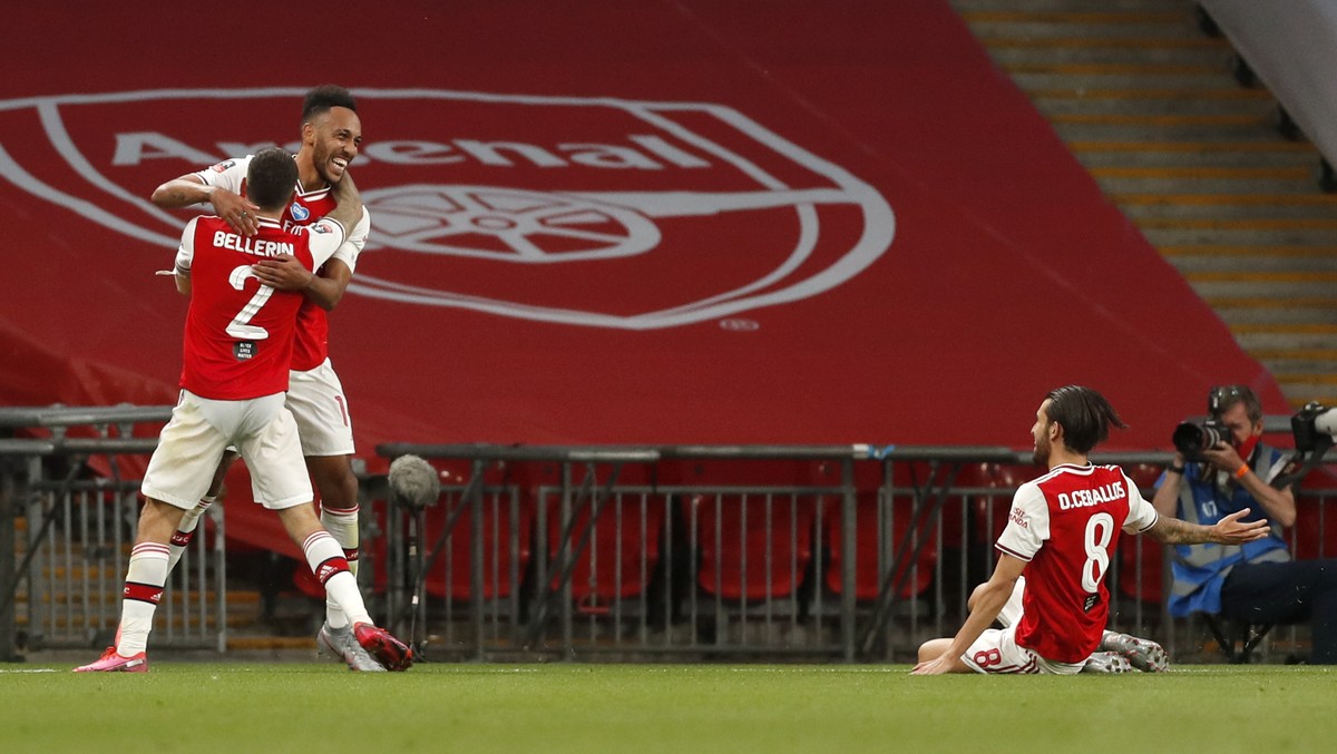 Arsenal's Pierre-Emerick Aubameyang, centre, celebrates with teammates after scoring his team's second goal during the FA Cup semifinal soccer match between Arsenal and Manchester City at We ...