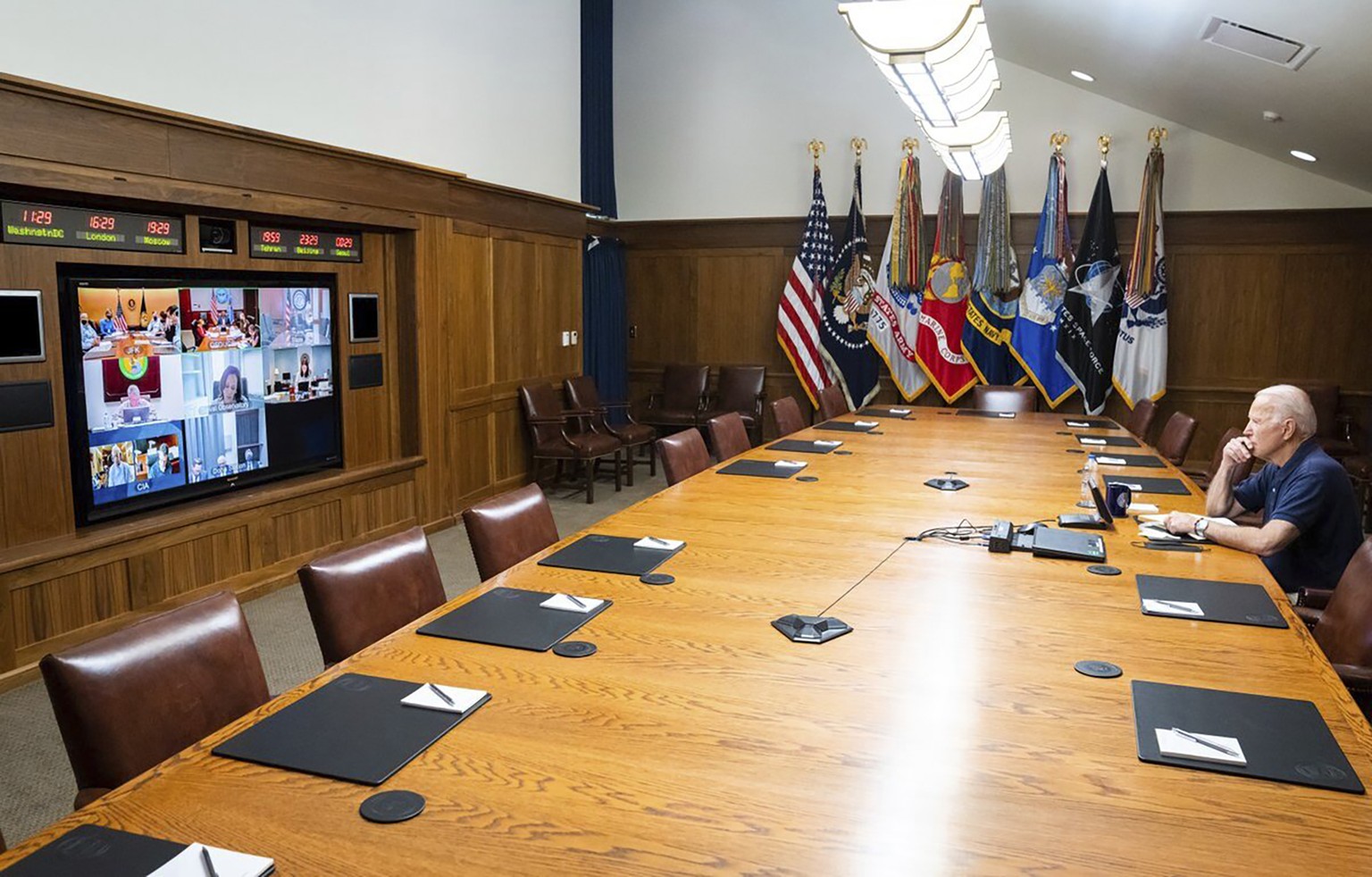 In this photo released by The White House, President Joe Biden meets virtually with his national security team and senior officials for a briefing on Afghanistan, Sunday, Aug. 15, 2021, at Camp David, ...