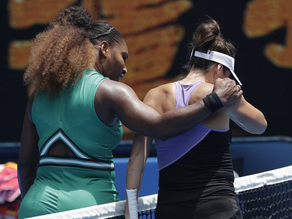 United States&#039; Serena Williams, left, embraces Germany&#039;s Tatjana Maria at the net following their first round match at the Australian Open tennis championships in Melbourne, Australia, Tuesd ...