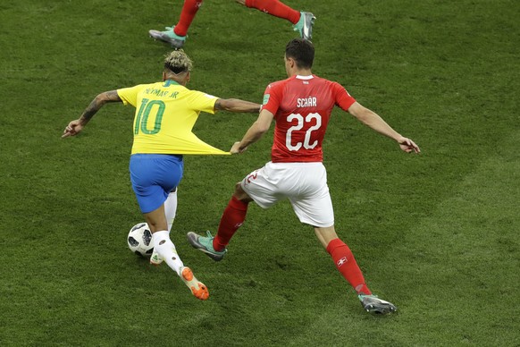 Switzerland&#039;s Fabian Schaer, right, holds Brazil&#039;s Neymar during the group E match between Brazil and Switzerland at the 2018 soccer World Cup in the Rostov Arena in Rostov-on-Don, Russia, S ...