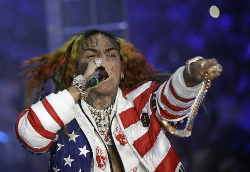 FILE- In this Sept. 21, 2018, file photo rapper Daniel Hernandez, known as Tekashi 6ix9ine, performs during the Philipp Plein women&#039;s 2019 Spring-Summer collection, Milan, Italy. Two men have bee ...