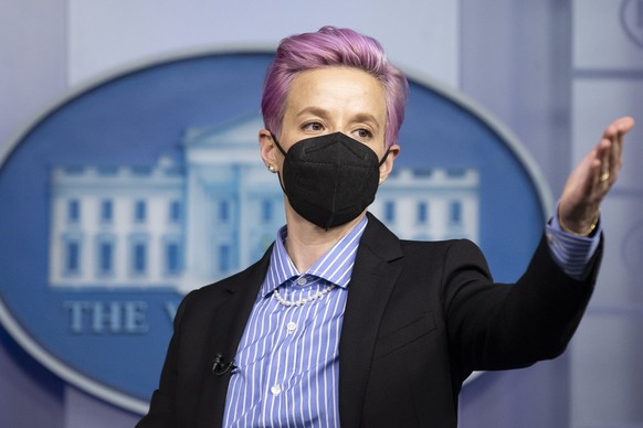 epa09094515 US soccer player Megan Rapinoe stands at the podium during a visit in the James Brady Press Briefing Room of the the White House in Washington, DC, USA, 24 March 2021. EPA/MICHAEL REYNOLDS ...