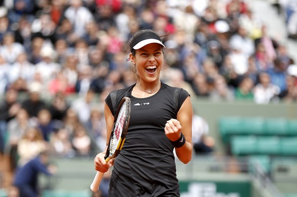 epa04777316 Ana Ivanovic of Serbia celebrates after winning against Ekaterina Makarova of Russia during their fourth round match for the French Open tennis tournament at Roland Garros in Paris, France ...