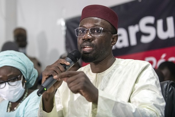 FILE - Senegalese opposition leader Ousmane Sonko speaks to journalists after his release from police custody in Dakar, Senegal, on March 8, 2021. Sonko suffered a major setback in his quest to...