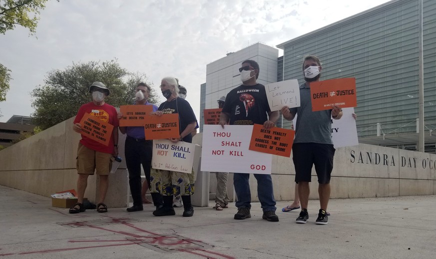 Members of Death Penalty Alternatives for Arizona demonstrate against the scheduled execution of the only Native American on federal death row, Tuesday, Aug. 25, 2020, outside the Sandra Day O'Connor  ...