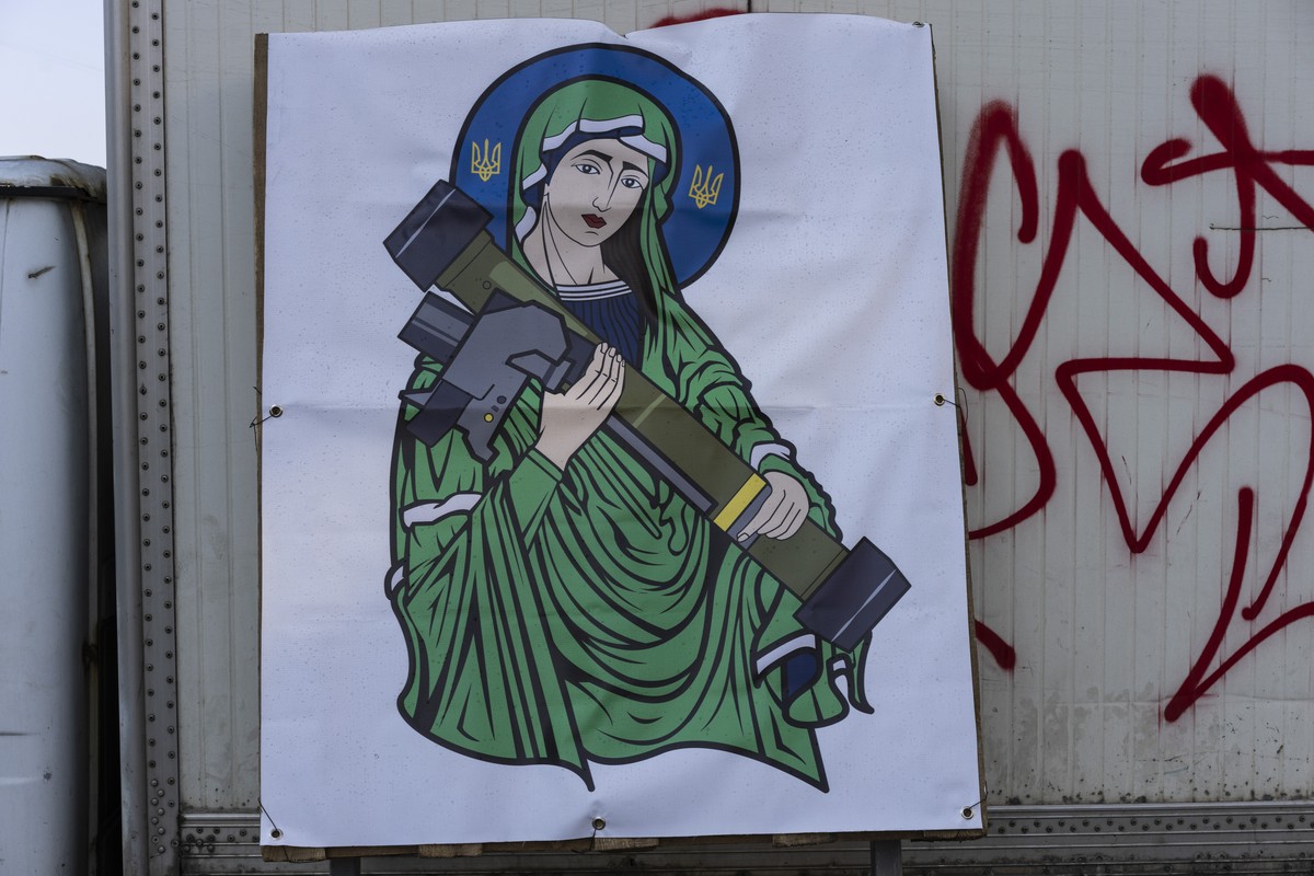 A banner with the image known as "Saint Javelin" depicting a saint holding a Javelin, an American-made portable anti-tank missile system, is displayed in a check point in Kyiv, Ukraine, Frid ...