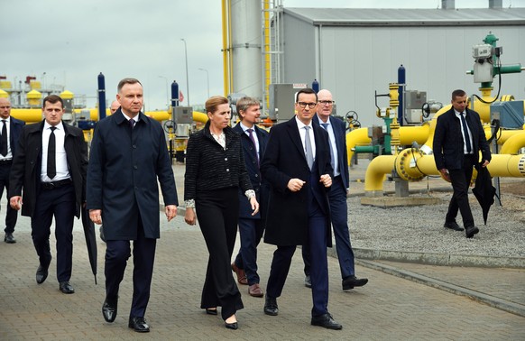 epa10209139 Polish President Andrzej Duda (L), Polish Prime Minister Mateusz Morawiecki (R) and Danish Prime Minister Mette Frederiksen (C) participates in the official opening of the &#039;Baltic Pip ...